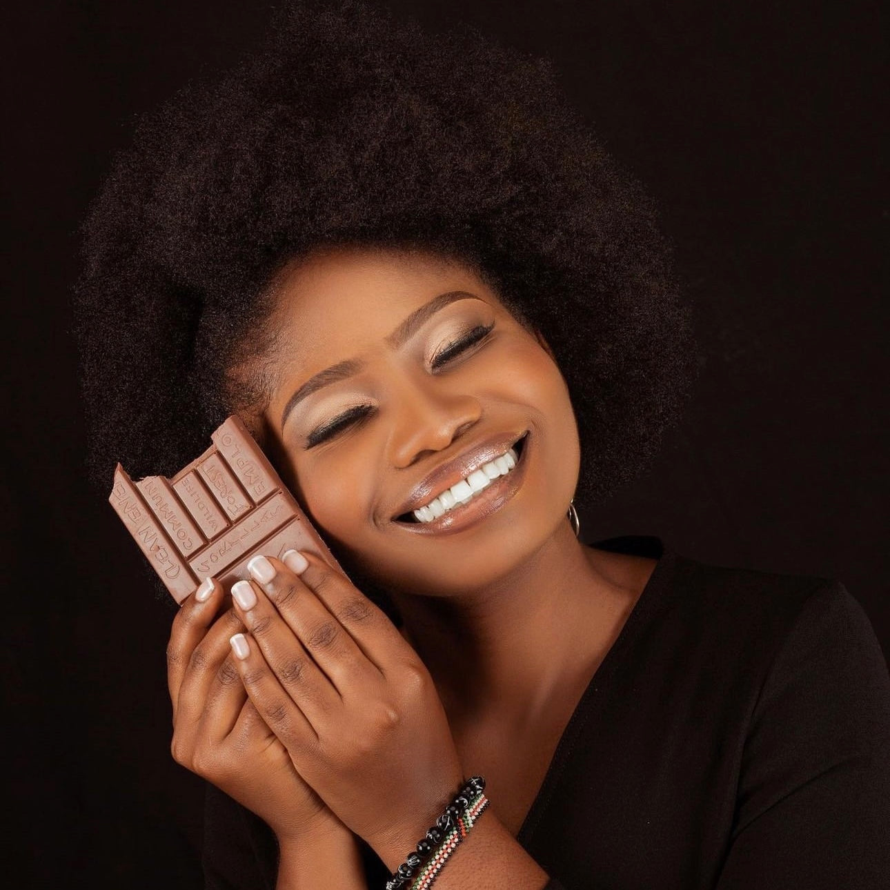 A girl eating Virunga chocolate