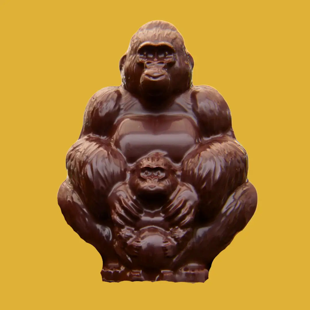 Chocolate gorilla figurine on a yellow background